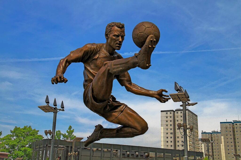 travel, sculpture, sky, statue, nature, outdoors, soccer