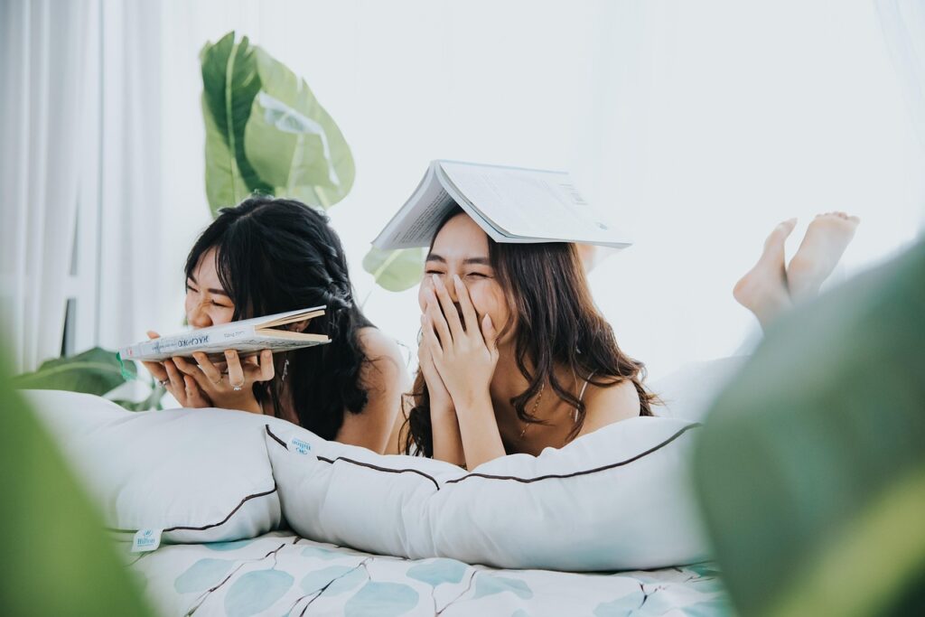 girls, books, laughs, young, cute, room, cheerful, smiling, playful, happy, portrait, friendship day
